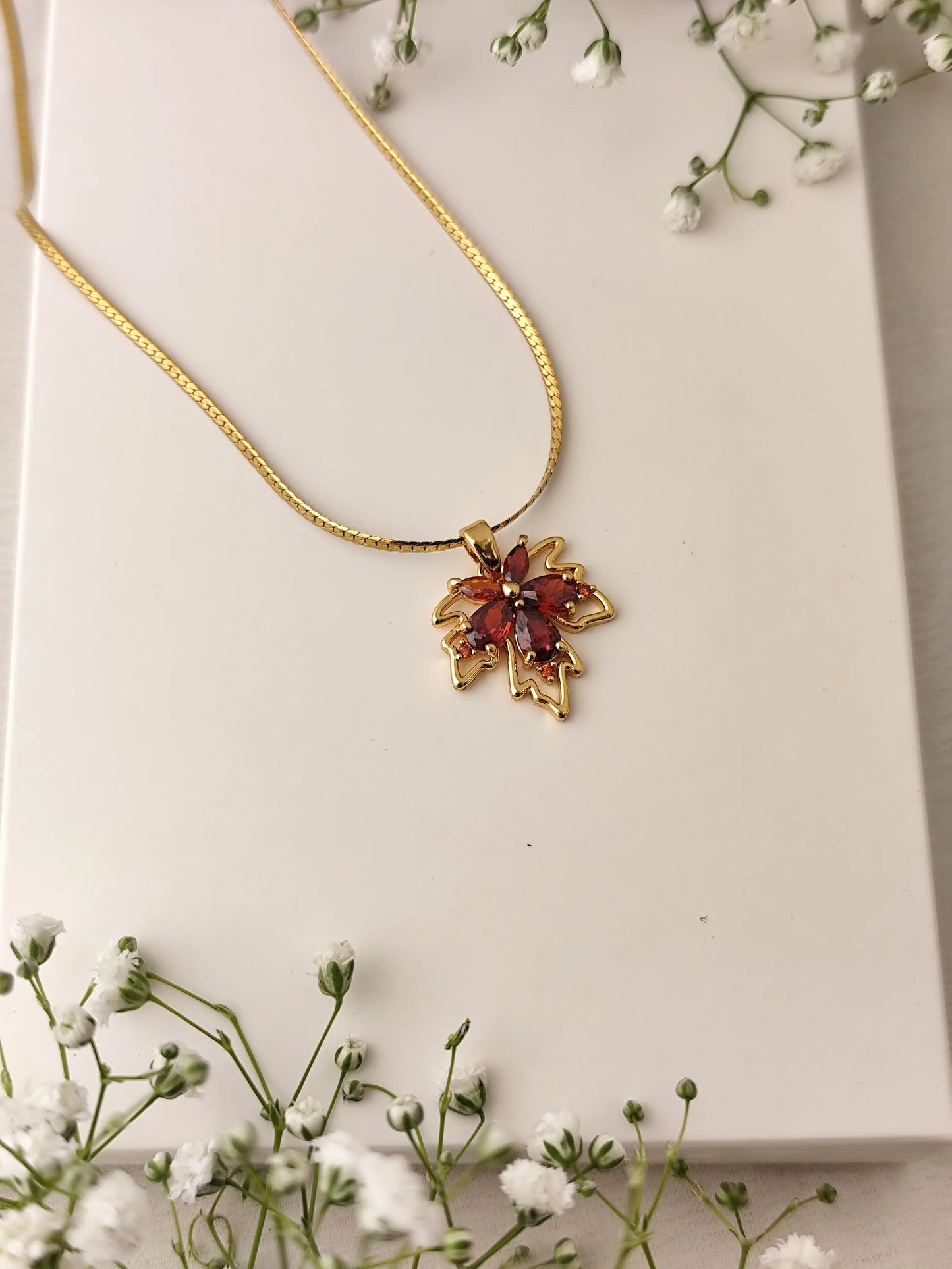 Maple Charm Gold Necklace – Red Crystal Pendant