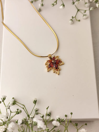 Maple Charm Gold Necklace – Red Crystal Pendant