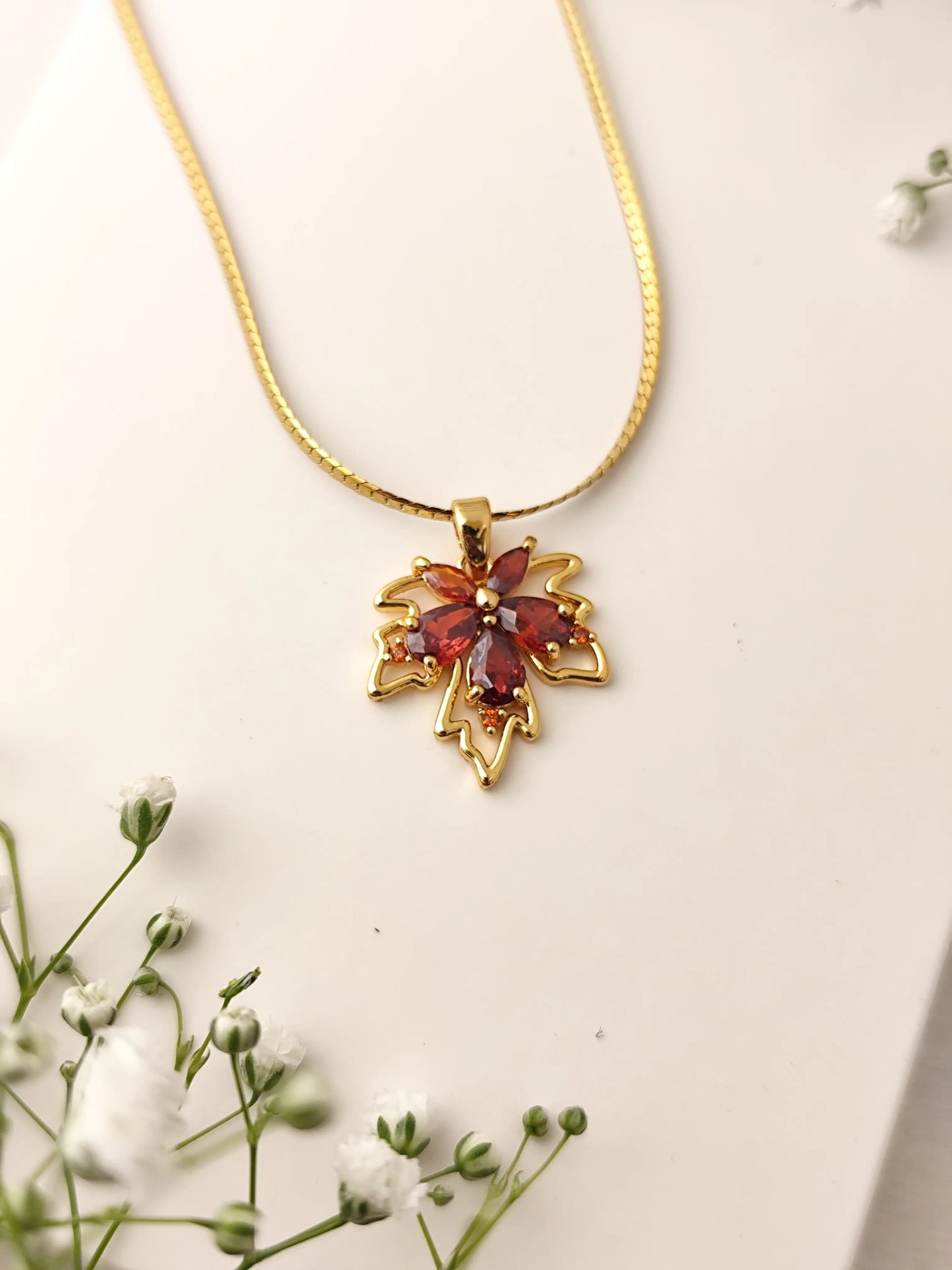 Maple Charm Gold Necklace – Red Crystal Pendant